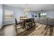 Open-concept dining and living space bathed in natural light, offering a versatile layout at 636 Olive Conch St, Ruskin, FL 33570