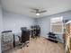 Bright office space with two computer workstations, a ceiling fan, and natural light at 636 Olive Conch St, Ruskin, FL 33570