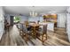 The open floor plan seamlessly connects the dining room, kitchen, and living room areas at 636 Olive Conch St, Ruskin, FL 33570