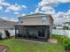 Relaxing screened-in patio with comfortable seating, offering a perfect outdoor living space at 636 Olive Conch St, Ruskin, FL 33570