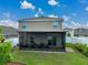Relaxing screened-in patio with comfortable seating, offering a perfect outdoor living space at 636 Olive Conch St, Ruskin, FL 33570