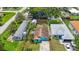 Aerial view of a property with a spacious backyard, storage shed and green surroundings at 6704 70Th N Ave, Pinellas Park, FL 33781