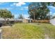 Expansive backyard with a storage shed, wooden fence, and ample green space at 6704 70Th N Ave, Pinellas Park, FL 33781