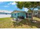 Back yard including mature tree, patio area, outdoor seating, and space for entertaining at 6704 70Th N Ave, Pinellas Park, FL 33781