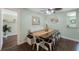 Cozy dining room featuring a rustic wood table, chic chairs, and built in bench seating at 6704 70Th N Ave, Pinellas Park, FL 33781
