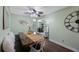 Light and airy dining room featuring a farmhouse-style table with seating and decorative accents at 6704 70Th N Ave, Pinellas Park, FL 33781