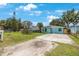 Inviting single-story house boasts a quaint fenced yard and long driveway, perfect for parking at 6704 70Th N Ave, Pinellas Park, FL 33781