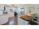 Updated kitchen boasts white cabinets, granite countertops, stainless appliances, and breakfast bar at 6704 70Th N Ave, Pinellas Park, FL 33781