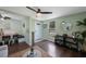 Bright living room featuring hardwood floors, stylish decor, and a view of the front yard at 6704 70Th N Ave, Pinellas Park, FL 33781