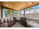Relaxing screened porch featuring wood ceiling, hammocks and cushioned seating at 6704 70Th N Ave, Pinellas Park, FL 33781