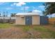 Exterior shot of a sturdy shed with double doors, perfect for storage or a workshop at 6704 70Th N Ave, Pinellas Park, FL 33781