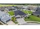 A sprawling property showcases an aerial perspective of the house with a well-manicured lawn at 6879 Talamore Dr, Wesley Chapel, FL 33545