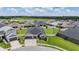 Aerial view of single-story home with large yard in residential neighborhood at 6879 Talamore Dr, Wesley Chapel, FL 33545