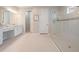 A spacious bathroom with double sinks, a makeup counter, and a large glass-enclosed shower at 6879 Talamore Dr, Wesley Chapel, FL 33545