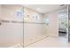 Modern bathroom featuring a glass-enclosed shower, neutral tiling, and bright lighting fixtures at 6879 Talamore Dr, Wesley Chapel, FL 33545