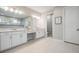 A spacious bathroom with double sinks, a makeup counter, and a large glass-enclosed shower at 6879 Talamore Dr, Wesley Chapel, FL 33545