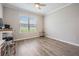 Bright and airy bedroom with large window, providing natural light and a view of the outdoors at 6879 Talamore Dr, Wesley Chapel, FL 33545