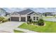 Charming home with a well-manicured lawn and a two-car garage, enhancing its curb appeal at 6879 Talamore Dr, Wesley Chapel, FL 33545