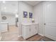 Hallway view with white cabinets at 6879 Talamore Dr, Wesley Chapel, FL 33545