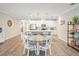 Inviting living area displays an open floor plan connecting the kitchen and dining spaces at 6879 Talamore Dr, Wesley Chapel, FL 33545