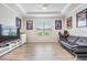 Spacious living room with comfortable seating, large window, and stylish decor for relaxation and entertainment at 6879 Talamore Dr, Wesley Chapel, FL 33545