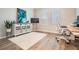 Well-lit home office with a large window, desk, and storage, creating a perfect workspace environment at 6879 Talamore Dr, Wesley Chapel, FL 33545