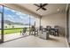 Covered patio with ceiling fan, and plenty of seating at 6879 Talamore Dr, Wesley Chapel, FL 33545