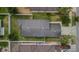Overhead shot of a home with a dark roof, fenced yard, and well-manicured landscaping at 7120 Forest Mere Dr, Riverview, FL 33578