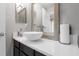 Modern bathroom featuring a stylish vessel sink and wooden framed mirror at 7120 Forest Mere Dr, Riverview, FL 33578