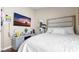Comfortable bedroom featuring a large bed and contemporary entertainment center at 7120 Forest Mere Dr, Riverview, FL 33578