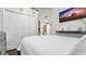 Primary bedroom with white bedding, closet, and TV at 7120 Forest Mere Dr, Riverview, FL 33578