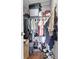 Overstuffed walk-in closet with wire shelving and hanging clothes at 7120 Forest Mere Dr, Riverview, FL 33578