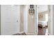 Hallway with white doors leading to bedrooms and closets at 7120 Forest Mere Dr, Riverview, FL 33578
