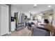 Open-concept kitchen features stainless steel appliances, white cabinets, and adjacent dining area at 7120 Forest Mere Dr, Riverview, FL 33578