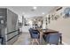 Spacious kitchen and dining area with stainless steel appliances and modern decor for stylish living at 7120 Forest Mere Dr, Riverview, FL 33578