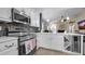Modern kitchen equipped with stainless steel appliances, white quartz countertops, and sleek cabinetry at 7120 Forest Mere Dr, Riverview, FL 33578