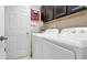 Functional laundry area with a full sized washer and dryer at 7120 Forest Mere Dr, Riverview, FL 33578