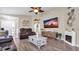 Spacious living room with modern ceiling fan and wood-look flooring at 7120 Forest Mere Dr, Riverview, FL 33578