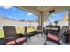 Screened in patio with outdoor seating overlooking the green backyard at 7120 Forest Mere Dr, Riverview, FL 33578
