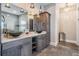 Chic bathroom with granite countertops, vessel sinks, pendant lights, and built-in storage cabinets at 7162 Graybrook Dr, Wesley Chapel, FL 33545
