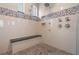 Modern bathroom with a walk-in shower and mosaic tile accents at 7162 Graybrook Dr, Wesley Chapel, FL 33545