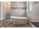 Bright bathroom with a freestanding tub and stylish tilework creating a spa-like oasis at 7162 Graybrook Dr, Wesley Chapel, FL 33545