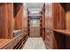 A walk-in closet with custom wood shelving and cabinets offers ample storage space at 7162 Graybrook Dr, Wesley Chapel, FL 33545