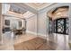 Open dining area featuring wood-look tile flooring, chandelier lighting, and seamless access to other living spaces at 7162 Graybrook Dr, Wesley Chapel, FL 33545