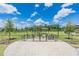 Fenced dog park with green space and shaded areas, offering a secure and enjoyable environment for pets at 7162 Graybrook Dr, Wesley Chapel, FL 33545