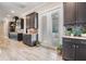 A gourmet kitchen featuring designer cabinets, granite counters, tile backsplash, and stainless steel appliances at 7162 Graybrook Dr, Wesley Chapel, FL 33545