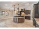 Gourmet kitchen featuring a center island, stainless steel appliances, and tiled flooring at 7162 Graybrook Dr, Wesley Chapel, FL 33545