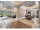 Open-concept living room showcasing stylish tile flooring, decorative ceilings, and lots of natural light at 7162 Graybrook Dr, Wesley Chapel, FL 33545