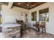 Outdoor kitchen with stainless steel grill, sink, stone counter, and a wood paneled ceiling at 7162 Graybrook Dr, Wesley Chapel, FL 33545