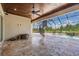 Large screened patio with spiral staircase, pool, and outdoor seating at 7162 Graybrook Dr, Wesley Chapel, FL 33545